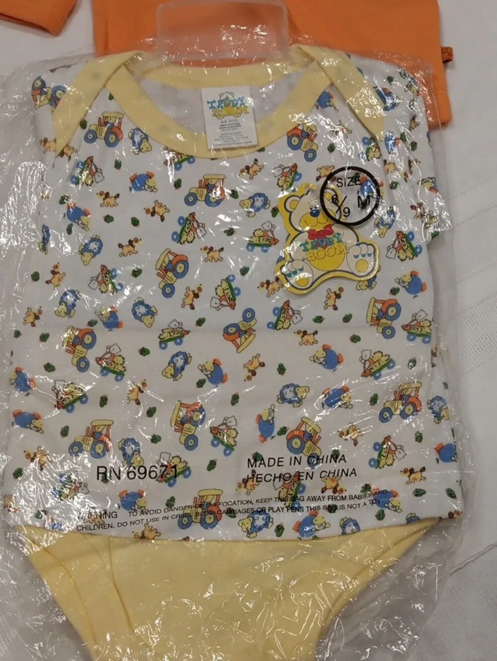 Circo Blue Bib with Orange Bodysuit and Yellow Printed Onesie